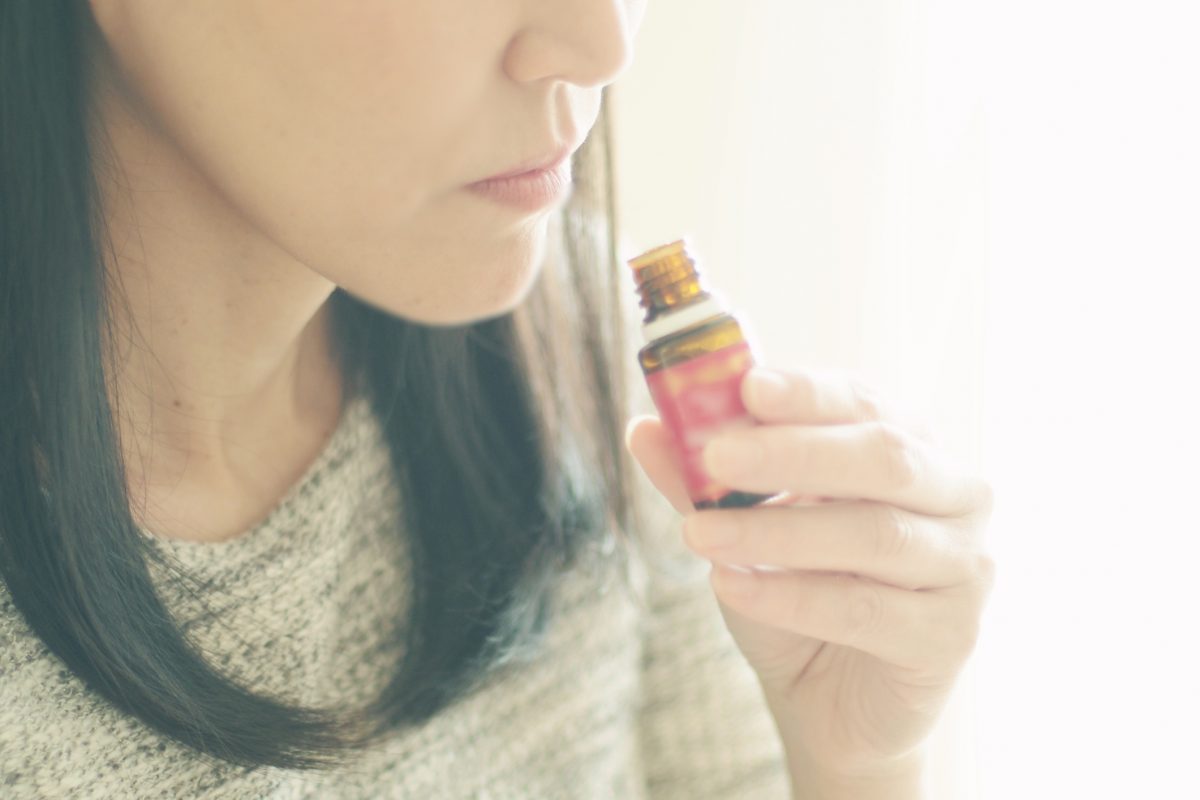 woman-smelling-the-essential-oil