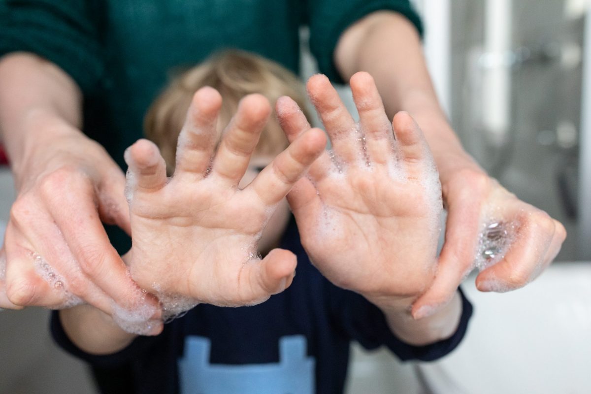 mother-and-son-washing-hands-together-to-remove-corona-virus