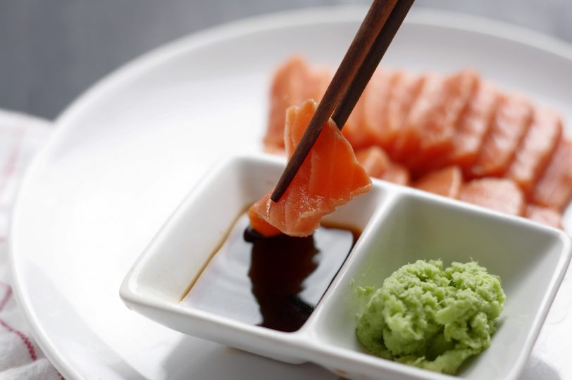 dipping-sliced-salmon-meat-in-sauce