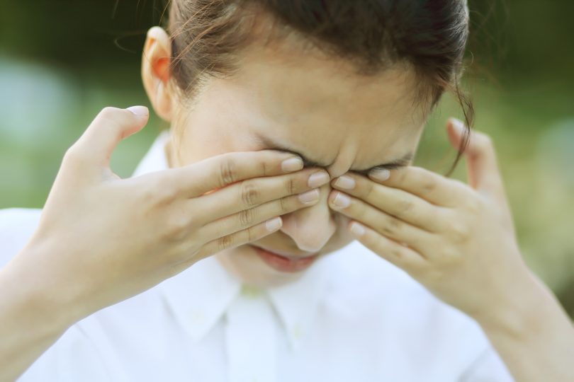 businesswoman-with-hands-on-eyes