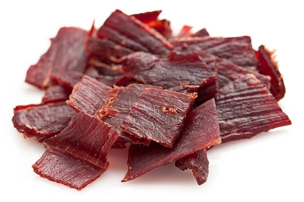 pile-of-beef-jerky-on-white-background
