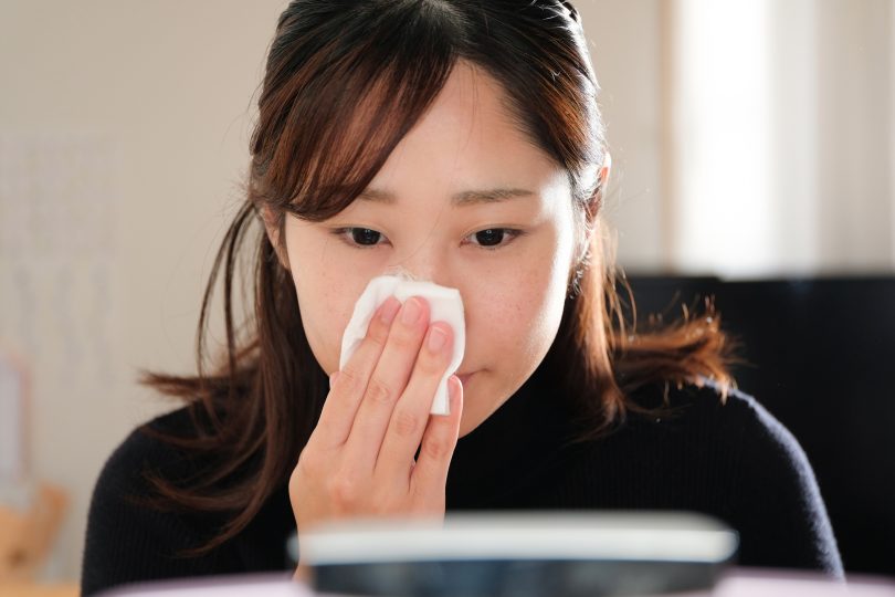 young-woman-applying-toner-on-her-face