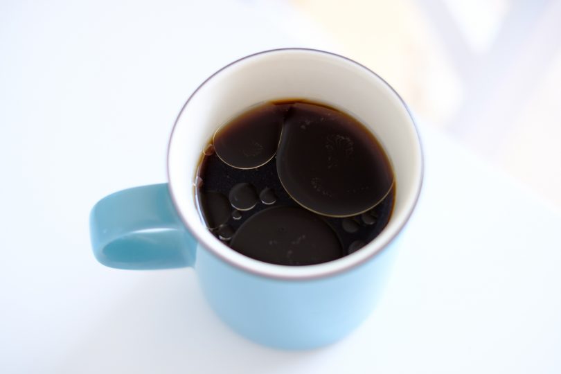 coconut-oil-on-the-surface-of-black-coffee