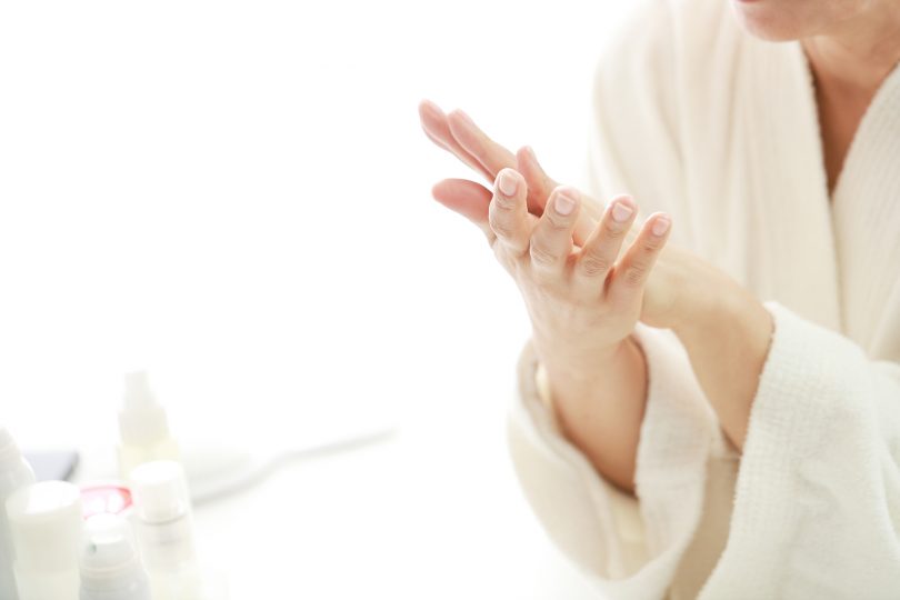 close-up-of-senior-woman-rubbing-hands