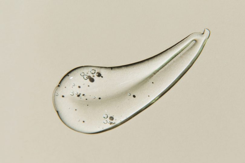 transparent-smear-of-gel-on-beige-background-liquid-hyaluronic-acid-gel-flat-lay-top-view-copy-space-2