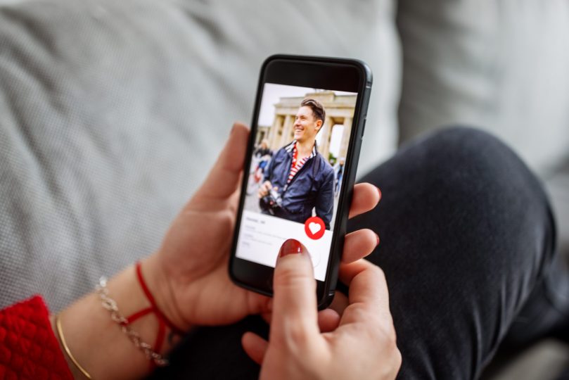 female-using-a-dating-app-on-smart-phone