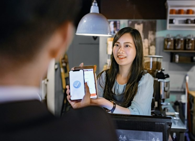 customer-paying-through-digital-wallet-at-cafe