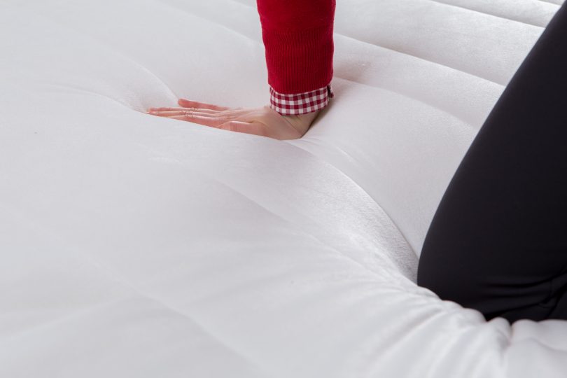 pressing-a-mattress