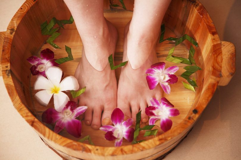 woman-taking-foot-bath-low-section