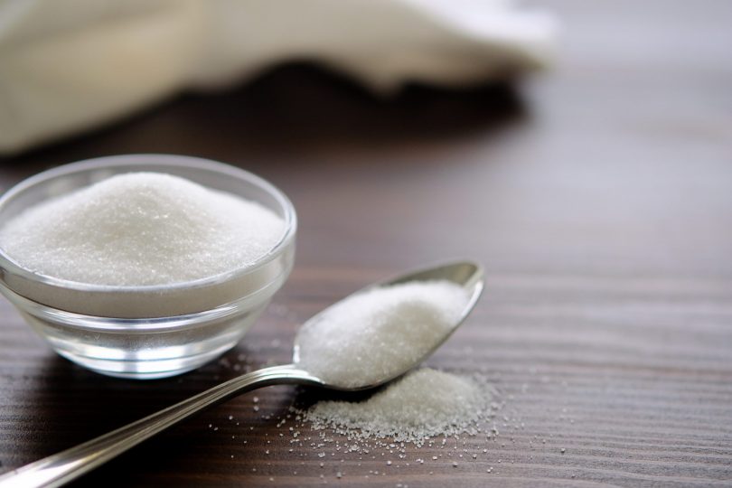 natural-seasoning-organic-sea-small-and-large-white-salt-in-a-spoon-in-a-cup-in-a-salt-shaker-poured-on-a-wooden-table-next-to-the-linen-towel-the-concept-of-cooking-healthy-food-cosmetology