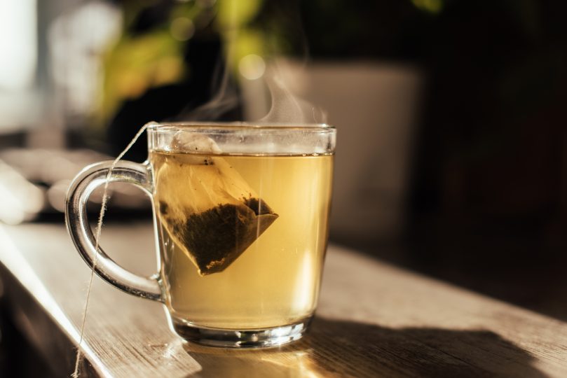 putting-tea-bag-into-glass-cup-full-of-hot-water-2