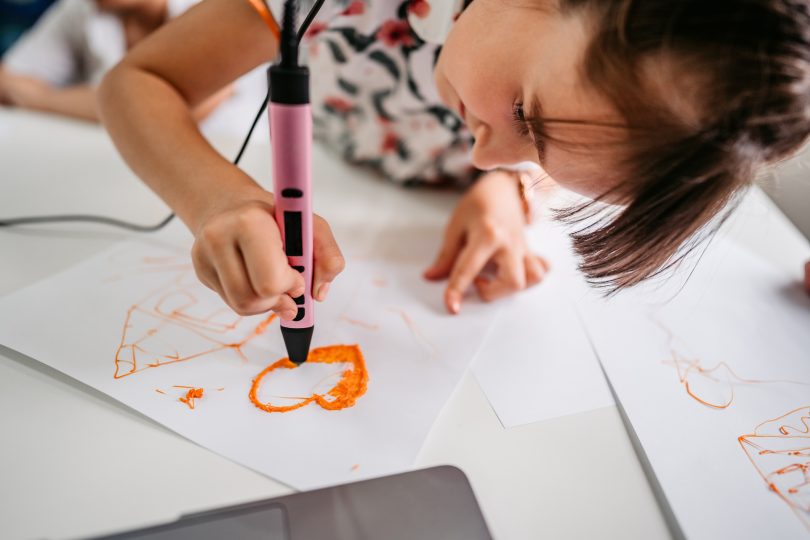 elementary-age-girl-creating-with-3d-printing-pen